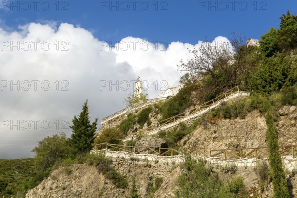 Exterior of Greek Orthodox church of Saint Mary, or Panagia Monastery, Dhermi, Albania steps leading up hillside