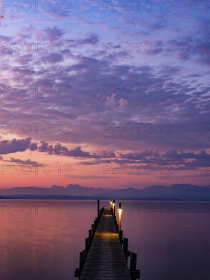 Footbridge on Lake Chiemsee at dawn, with the Chiemgau Alps behind, Chiemgau, Upper Bavaria, Bavaria, Germany, Europe