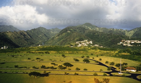 Roads for a theme park with the mountains of the Lamb Range in the background, suburb of Worree, Cairns, Queensland, Australia 1956 now Ingenia Holidays Cairns Coconut