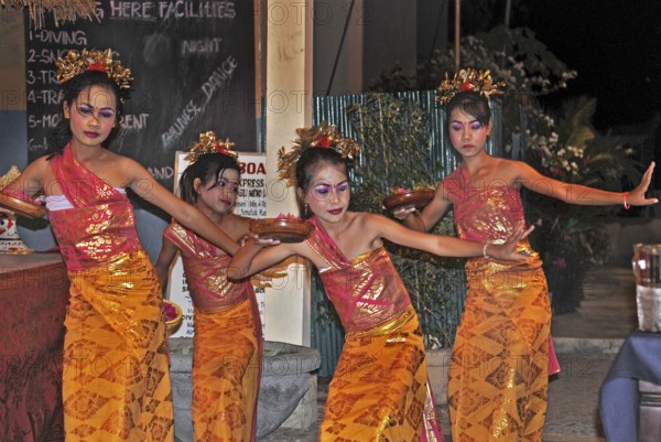 Balinese girls dancing for dinner, Amed, Bali, Indonesia, Asia
