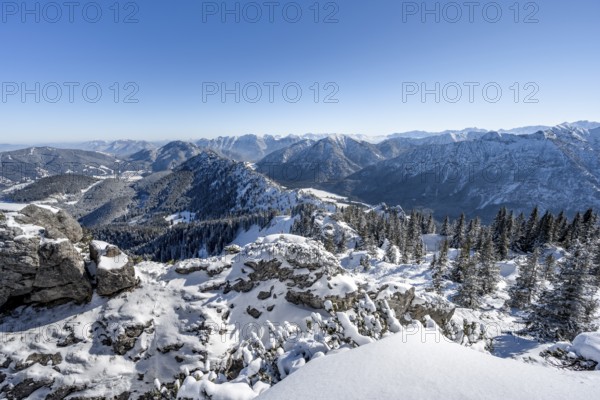 Snow-covered mountain landscape, view of forest and mountain panorama at Teufelstättkopf, Ammergau Alps, Bavaria, Germany, Europe