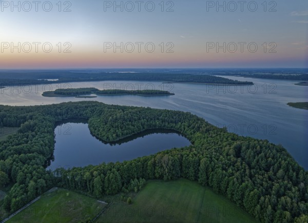 Aerial view of Lake Wigry and the landscape in the Wigry National Park in northern Poland in the evening light. Krusznik, Podlaskie, Poland, Europe