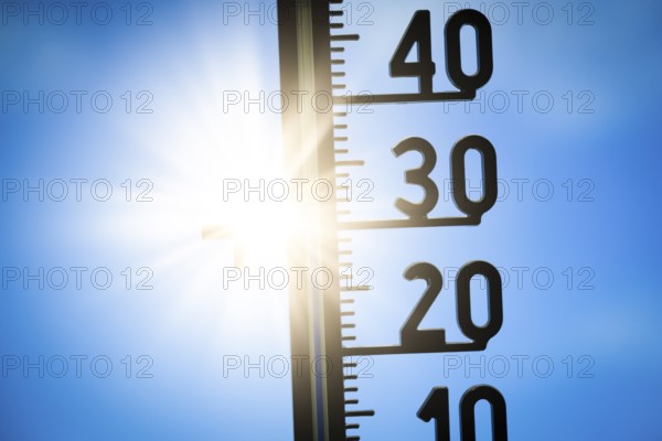 Symbolic image, global warming, A thermometer shows a high temperature under a bright sun in a clear sky Sun, heat wave, Baden-Württemberg, Germany, Europe