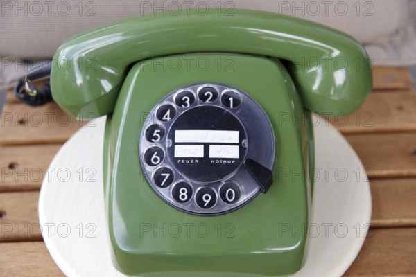 Telephone, obsolete, green, dialling disc, An antique telephone with dialling disc