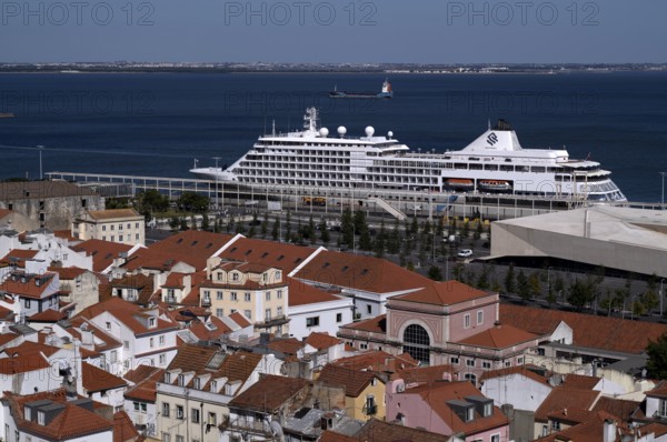 View from the viewpoint Miradouro de Santa Luzia, luxury cruise ship Silver Whisper of the Silver Cruises Group moored in the harbour, city view, Alfama, Lisbon