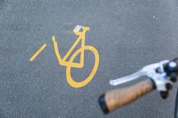 Detached pictogram of a pop-up cycle path with cyclist, Düsseldorf, Germany, Europe