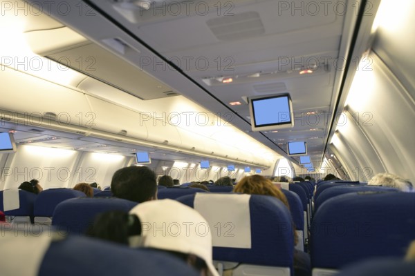Airplane with passengers interior view