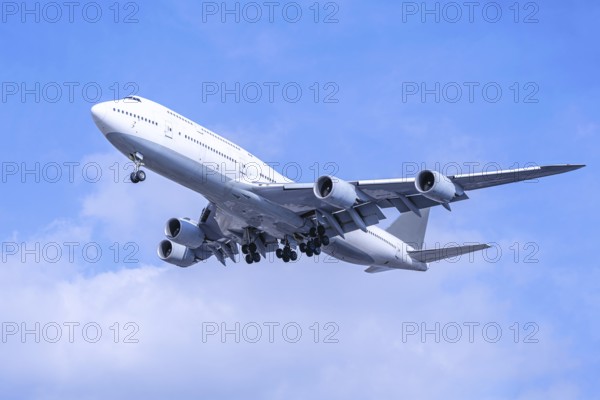 modern airliner against a blue sky