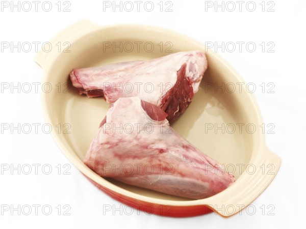 Shanks, raw red meat, chopped, in a dutch oven, unseasoned