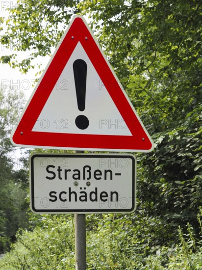 Traffic sign Attention with road damage, North Rhine-Westphalia, Germany, Europe