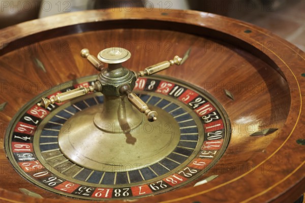 Old wooden roulette wheel in a casino