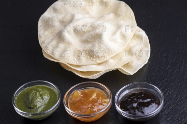 Papadam with various Indian sauces
