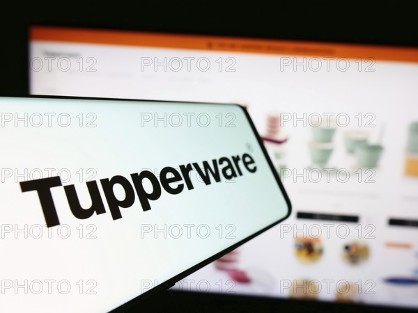Stuttgart, Germany, 11-10-2023: Smartphone with logo of American home product company Tupperware Brands Corporation in front of website. Focus on center-left of phone display, Europe