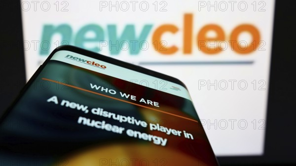 Stuttgart, Germany, 06-25-2022: Mobile phone with website of British energy company newcleo S.r.l. on screen in front of business logo. Focus on top-left of phone display, Europe