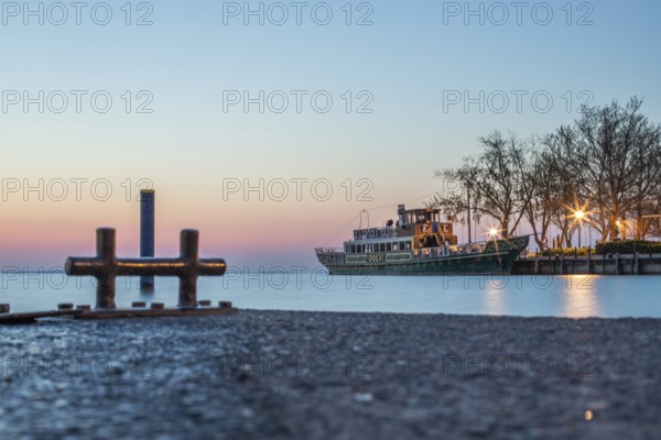 Sunrise on the shore and harbour of a lake in summer. Colourful sky with a wide view of the horiont. Natural landscape at Tihany marina, Lake Balaton, Lake Balaton, Siófok, Hungary, Europe