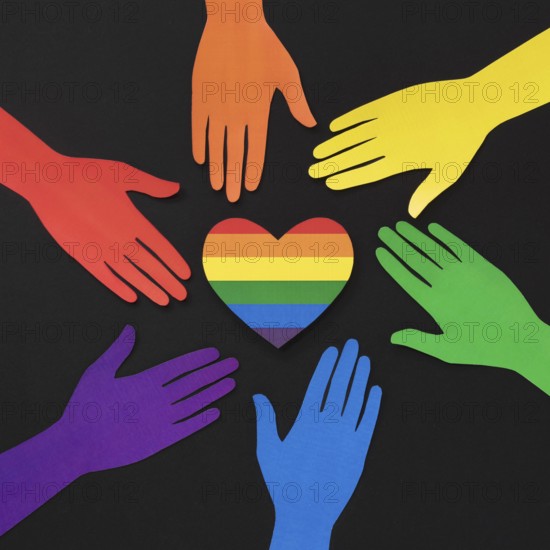 Diversity composition different colored paper hands with rainbow heart
