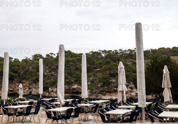 Empty restaurant terrace in the low season in Cala Figuera near Santanyí, Majorca, Balearic Islands, Spain, Europe