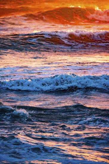 Sunset with high waves at the sea with psychedelic colours, Portbail, English Channel, Cotentin, Manche, Normandy, France, Europe