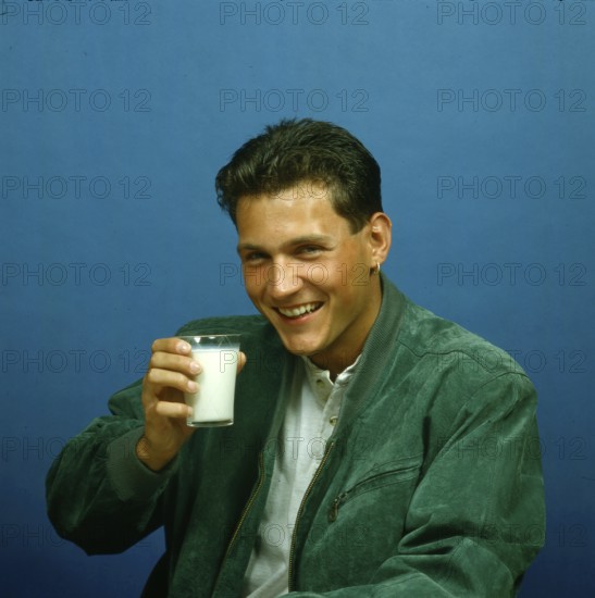 Young man with milk glass