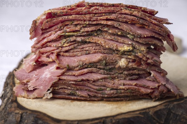 Stack of sliced pastrami meat