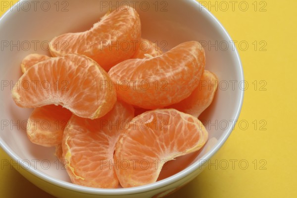 Clementine pieces in peel, citrus fruit