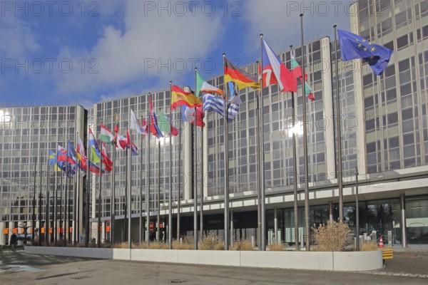 Modern building Winston Churchill with row of European national flags, state flag, European, EU flag, modern building, glass building, glass windows, politics, international, EU Parliament, Strasbourg, Bas-Rhin, Alsace, France, Europe