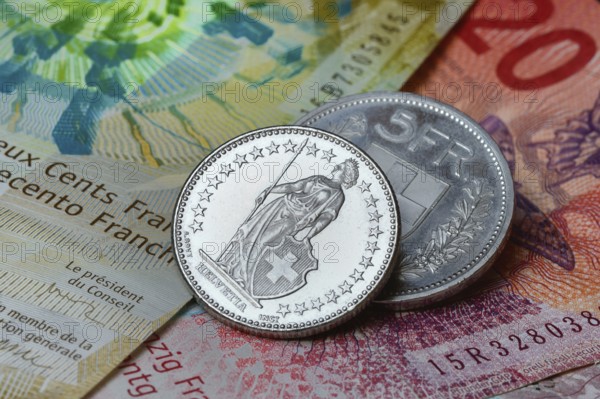 Swiss coins on banknotes, Switzerland, Europe