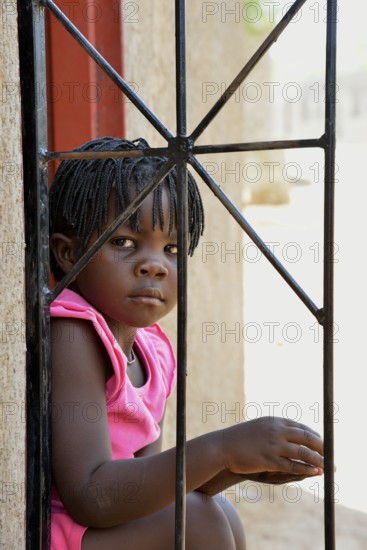 Himba girl in a house in the Himba district of Otuzemba, Otuzemba, Opuwo, Kaokoland, Kunene, Namibia, Africa