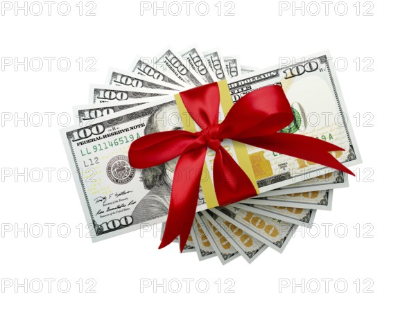 Overhead of one hundred thousand dollars spiralling stacks of one hundred dollar with red bow bills isolated on a white background.
