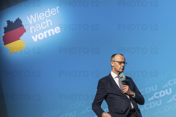 New Year's reception of the CDU with chancellor candidate Friedrich Merz in Künzelsau. The Federal Chairman of the CDU and Chairman of the CDU-CSU parliamentary group spoke to an audience of 2000 at the Carmen Würth Forum. Portrait during his speech on stage. Künzelsau, Baden-Württemberg, Germany, Europe