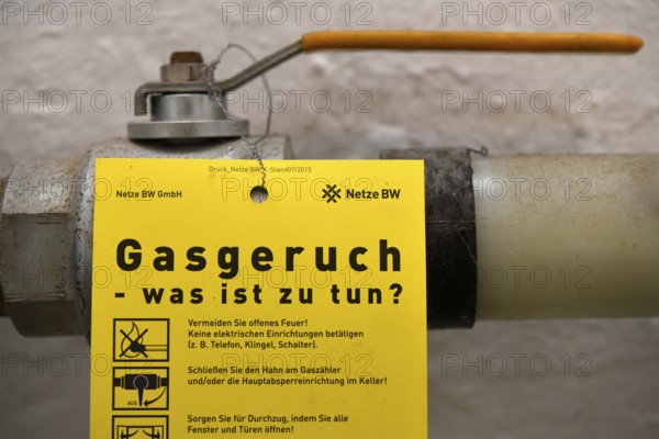 Gas tap, gas main tap, yellow, information sign, gas odour, Netze BW GmbH, old heating system, gas heating, building services, Stuttgart, Baden-Württemberg, Germany, Europe