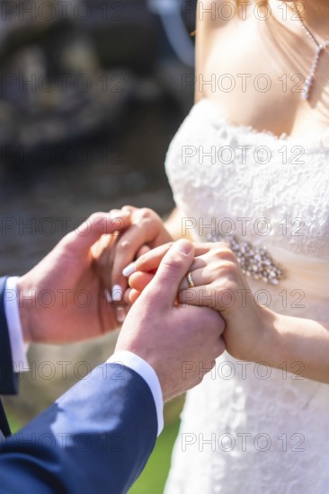 Detail of hands at the wedding of the happy bride and groom, marriage portraits