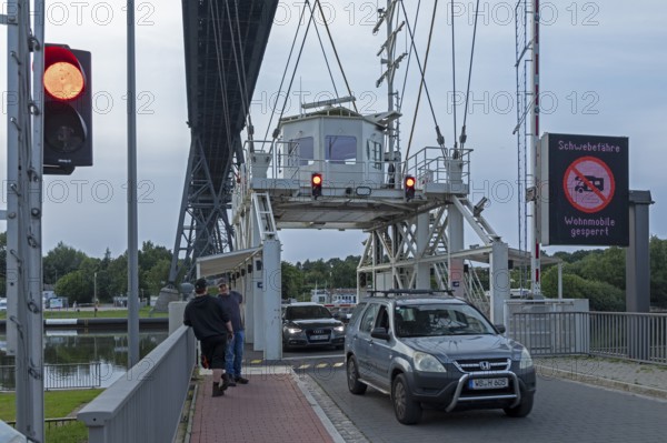 Cars leaving transporter bridge, red traffic light, high bridge, Kiel Canal, Rendsburg, Schleswig-Holstein, Germany, Europe