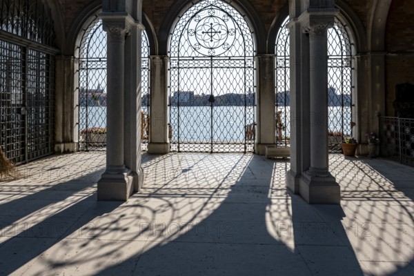 Gate at the cemetery wall, view of the lagoon, Cemetery Island San Michele, Venice, Italy, Europe