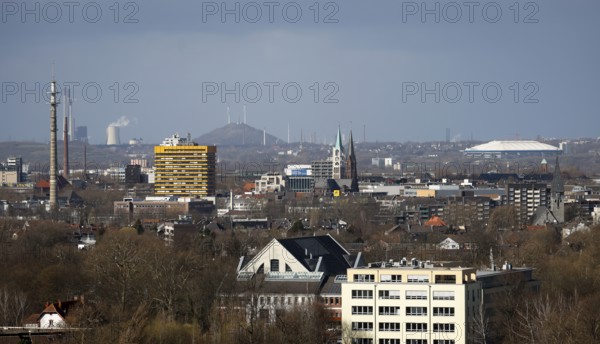 Gelsenkirchen, North Rhine-Westphalia, Germany - City overview Gelsenkirchen with old town church, in the back right Schalke stadium, in the back left slagheap Oberscholven and Uniper power plant Scholven
