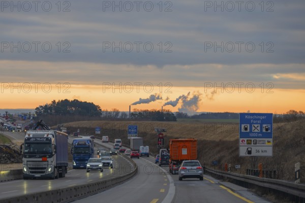 Evening traffic on the A9 motorway, smoking chimneys behind, Bavaria, Germany, Europe