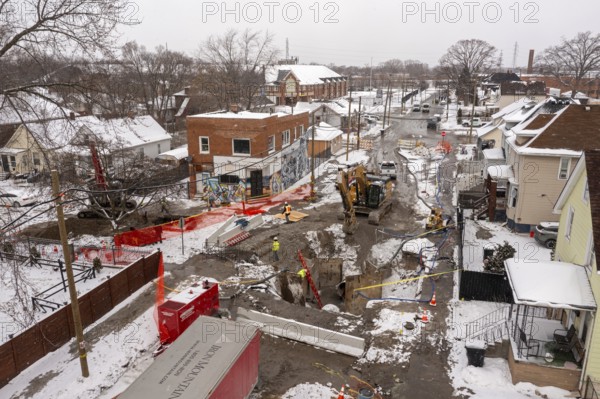 Detroit, Michigan - Workers repair a water main break that flooded streets and homes in southwest Detroit. The 54-inch pipeline that failed dates to the 1930s