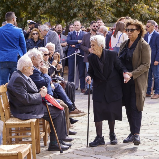 Survivors of the massacre of 3 June 1941, Elderly woman with walking aid at an outdoor gathering of elderly people, Visit of Federal President Frank-Walter Steinmeier to Kandanos on 31 October 2024, Federal President, Frank-Walter Steinmeier, memorial, war crimes, Nazis, Wehrmacht crimes, World War II, Kandanos, Southwest Crete, Crete, Greek Islands, Greece, Europe