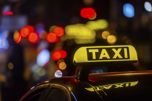 Illuminated taxi sign in the evening, symbolic photo, Stuttgart, Baden-Württemberg, Germany, Europe