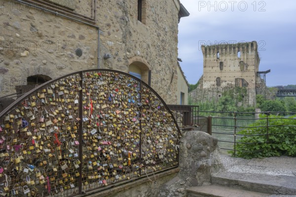 Love locks by an old mill wheel, Borghetto, Valeggio sul Mincio, Province of Verona, Italy, Europe