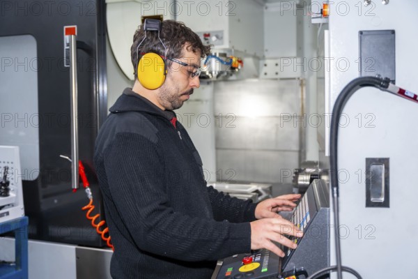 Factory worker who made the necessary coding in CNC modern machine