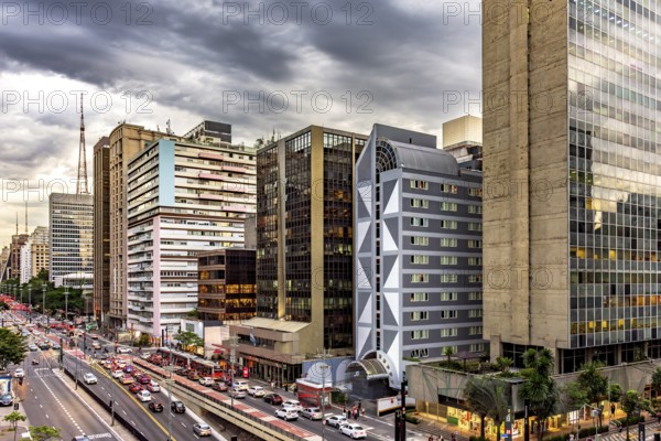 Car traffic between buildings on Paulista Avenue in Sao Paulo, Sao Paulo, Sao Paulo, Brazil, South America