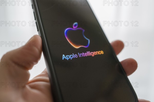 Hand holding iPhone with Apple logo and the text 'Apple Intelligence', bright and modern illustration, symbolic image of artificial intelligence