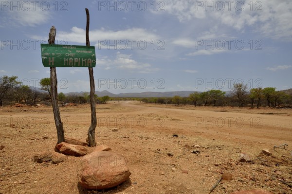 Sign at the entrance to the village of Omuramba, residential village of Chief Hikuminue Kapika, the tribal leader of the Namibian Himba people, Omuramba, Kaokoland, Kunene, Namibia, Africa