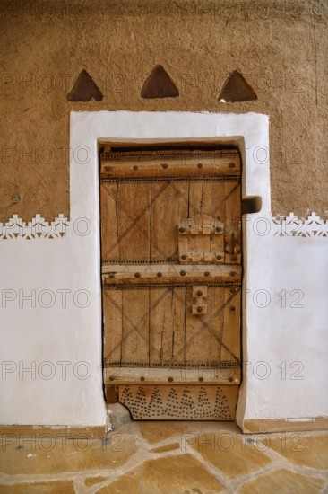 Old door in Al Masmak Fort, historic fortress built in 1865, in the old city of Riyadh, Saudi Arabia, Asia