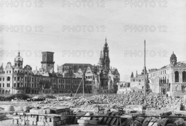 DEU Sachsen Dresden Dresden 1945, ruins of the Residenzschloss, the Georgentor, the Hofkirche, the Ständehaus and the Johanneum seen from Rosmariengasse. Scan of the original photo, unknown estate