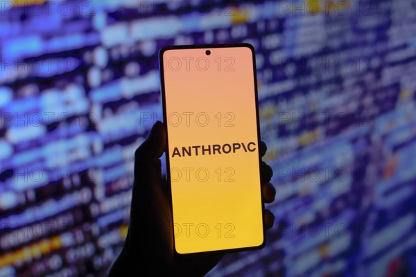 In this photo illustration, the Anthropic logo is displayed on a smartphone screen