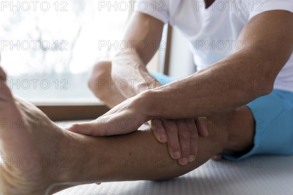 Close up legs hands doing stretching exercises