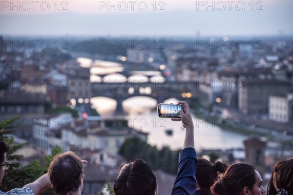 FLORENCE, ITALY, SEPTEMBER 21, 2023, Large tourist crowd on Piazzale Michelangelo enjoying sunset over Florence, Italy, Europe