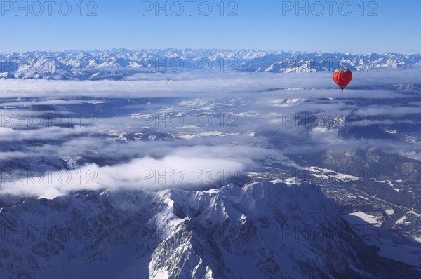 Hot-air balloon flying over Wilder Kaiser Mountain, Kössen, Tyrol, Austria, Europe